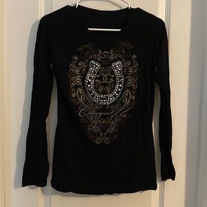 Black long sleeve tight fitted shirt with a bedazzled horseshoe design